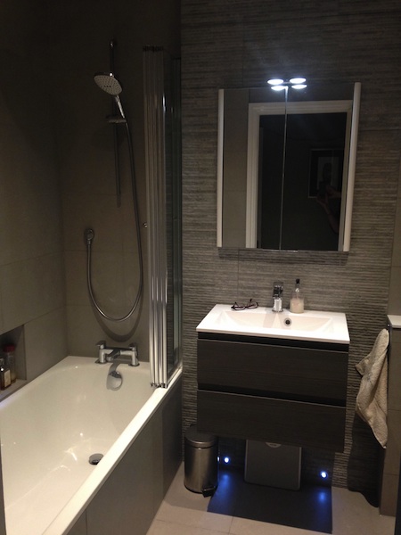 Small bathroom installation in Redland, Bristol - close up of basin and vanity unit and bath with shower