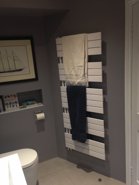Small bathroom installation in Redland, Bristol - towel rail and inbuilt shelf for books and knick knacks